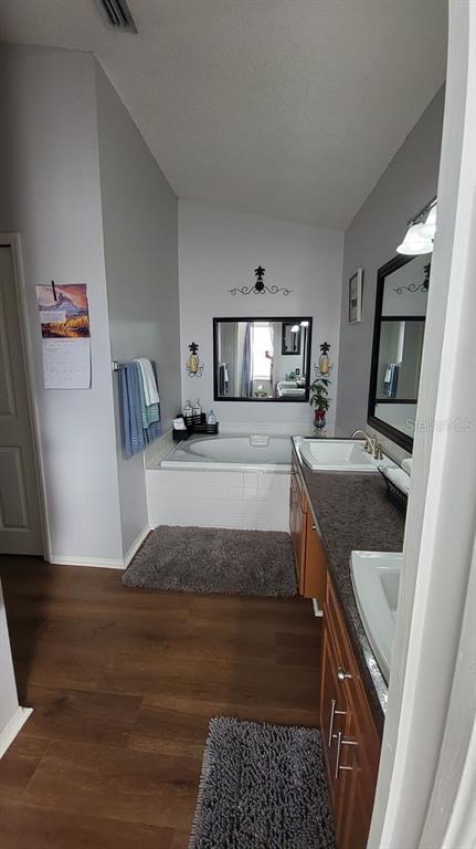 9165 Eldridge Road Spring Hill, FL 34608 - Photo 11 of 17 a kitchen with granite countertop a stove and a sink