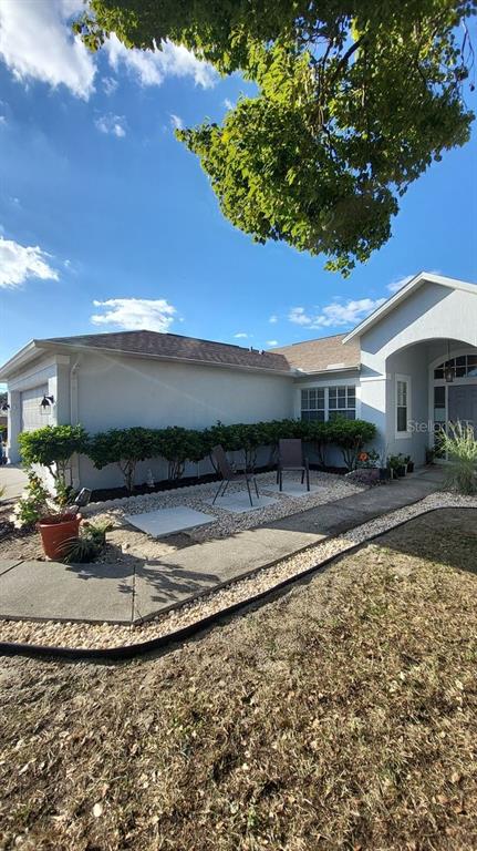 9165 Eldridge Road Spring Hill, FL 34608 - Photo 2 of 17 a view of a house with a yard