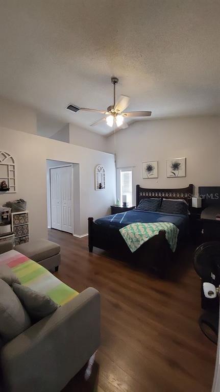 9165 Eldridge Road Spring Hill, FL 34608 - Photo 7 of 17 a living room with furniture and a wooden floor