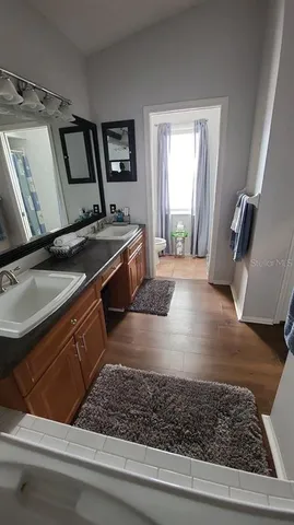 a kitchen with stainless steel appliances granite countertop a sink stove and granite counter tops