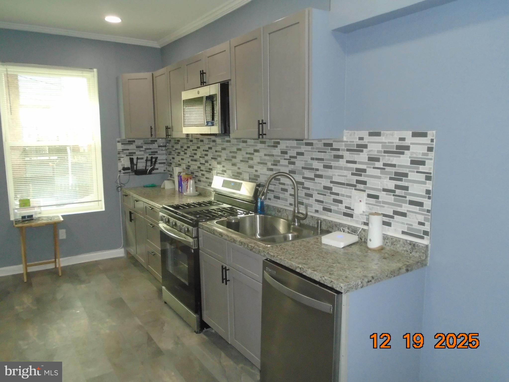 2903 Jefferson Street Baltimore, MD 21205 - Photo 11 of 48 a kitchen with sink cabinets and window