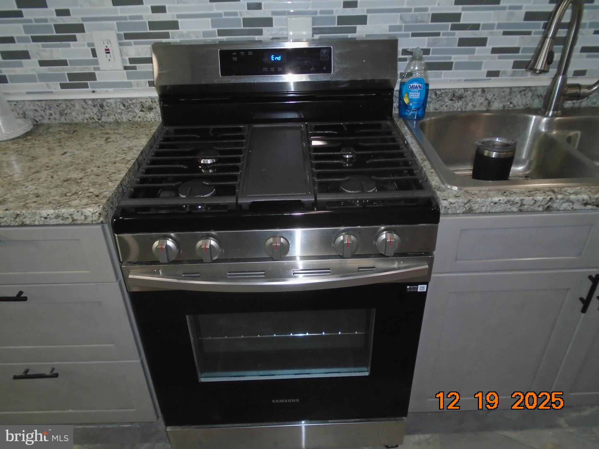 2903 Jefferson Street Baltimore, MD 21205 - Photo 14 of 48 a stove top oven sitting inside of a kitchen