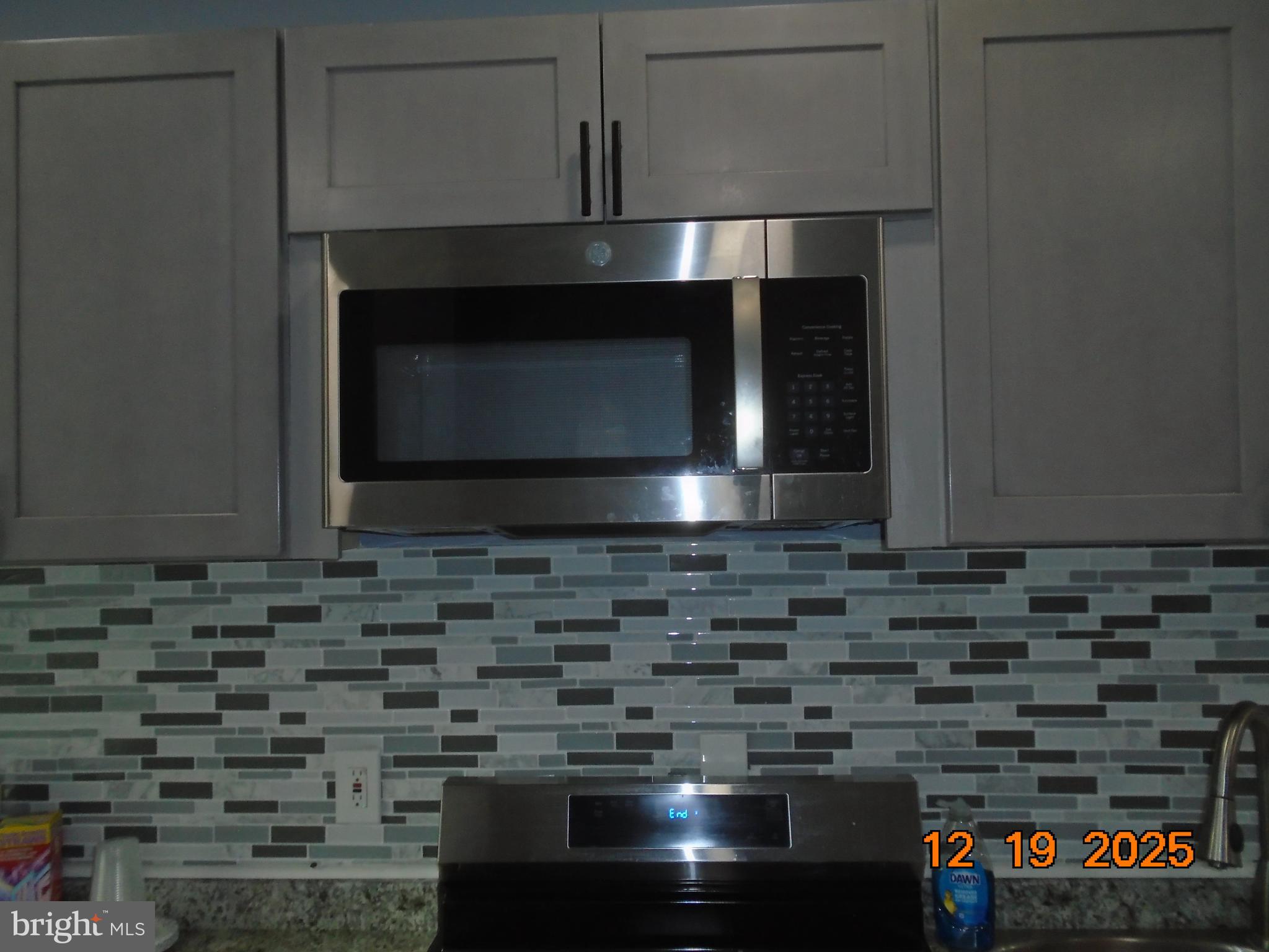 2903 Jefferson Street Baltimore, MD 21205 - Photo 16 of 48 a stove top oven sitting inside of a kitchen