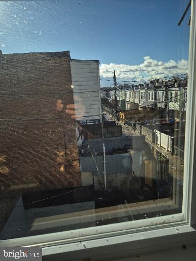2903 Jefferson Street Baltimore, MD 21205 - Photo 22 of 48 a bathroom with a glass shower door