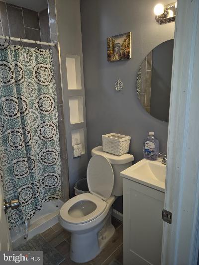 2903 Jefferson Street Baltimore, MD 21205 - Photo 28 of 48 a white toilet sitting next to a bathroom sink