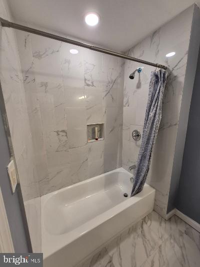 2903 Jefferson Street Baltimore, MD 21205 - Photo 29 of 48 a bathroom with a shower and a tub