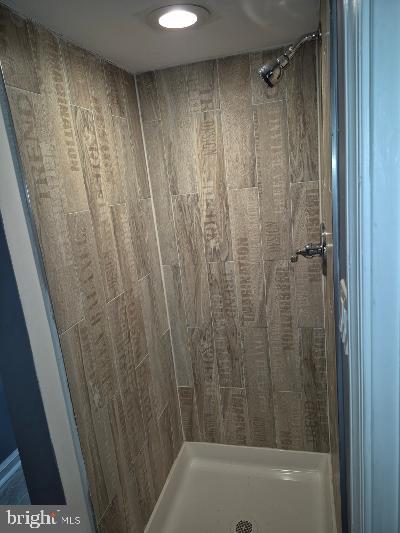 2903 Jefferson Street Baltimore, MD 21205 - Photo 39 of 48 a bathroom with a shower and a bath tub