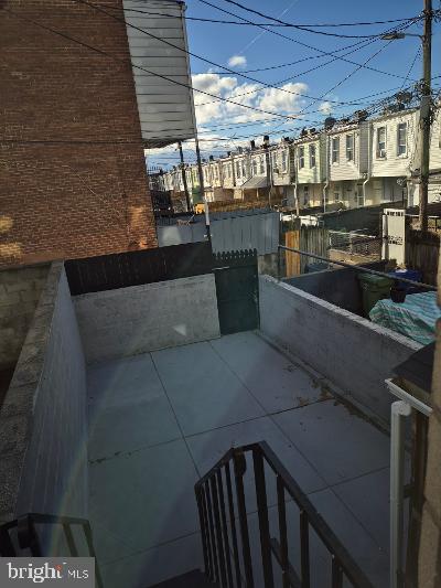 2903 Jefferson Street Baltimore, MD 21205 - Photo 47 of 48 a open kitchen with stainless steel appliances kitchen island granite countertop a stove and a sink