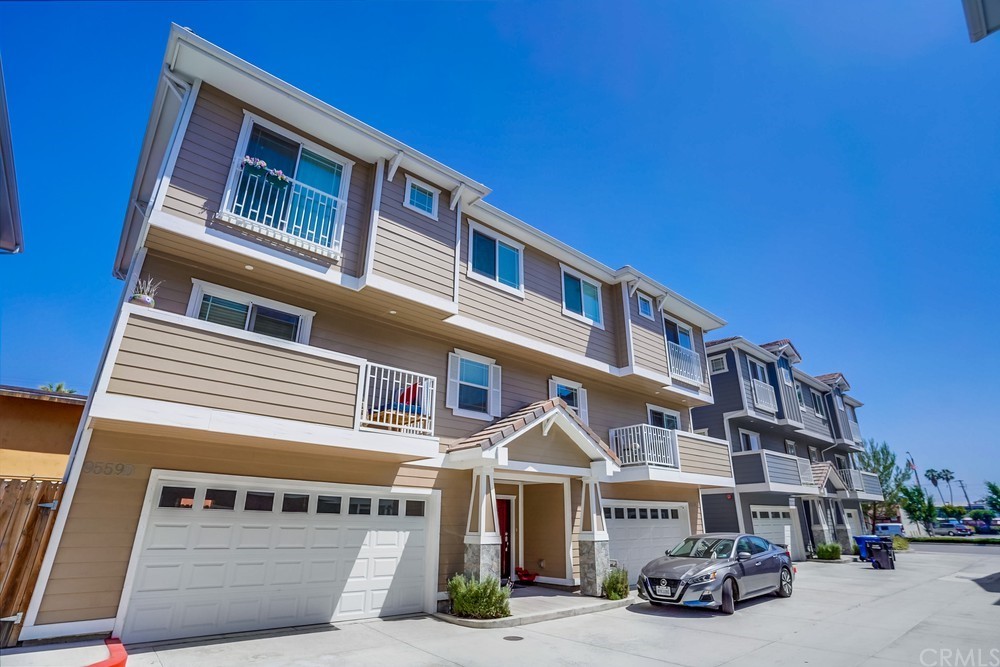 a front view of a building with parking space