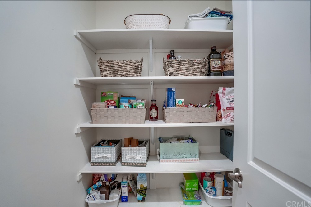9559 Firestone Boulevard, Unit D Downey, CA 90241 - Photo 14 of 24 a shelf with books and knick knacks on it