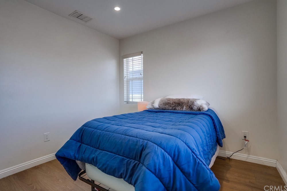 9559 Firestone Boulevard, Unit D Downey, CA 90241 - Photo 16 of 24 a bedroom with a bed and window