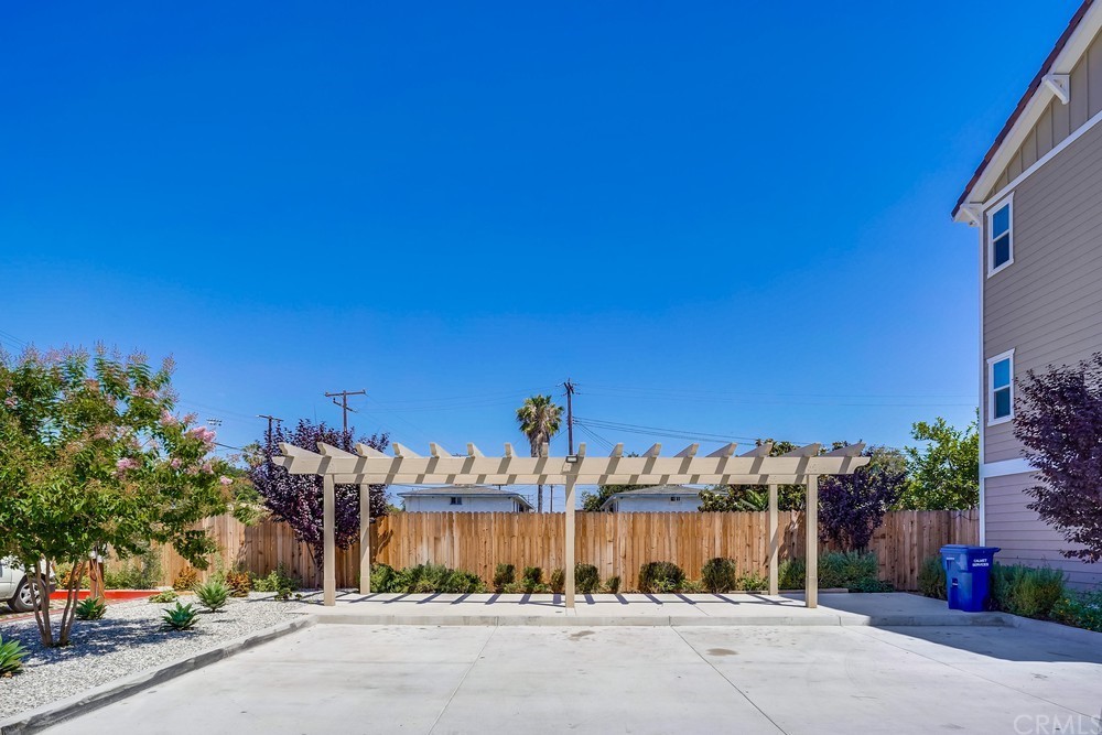 9559 Firestone Boulevard, Unit D Downey, CA 90241 - Photo 20 of 24 a view of a street with a building in the background