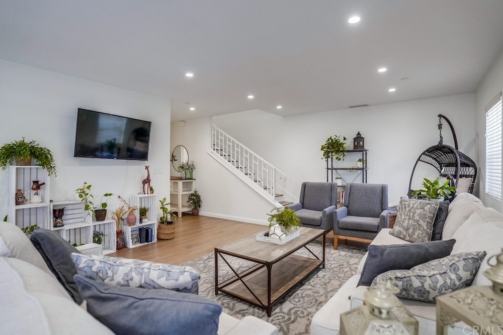 9559 Firestone Boulevard, Unit D Downey, CA 90241 - Photo 3 of 24 a living room with furniture and a flat screen tv