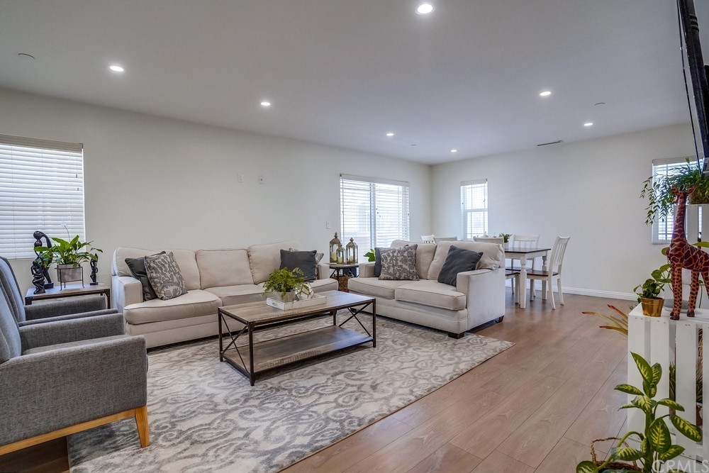 9559 Firestone Boulevard, Unit D Downey, CA 90241 - Photo 5 of 24 a living room with furniture and wooden floor