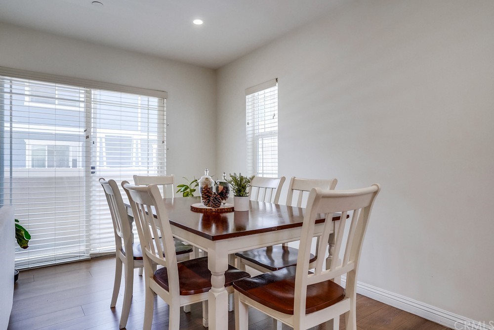 9559 Firestone Boulevard, Unit D Downey, CA 90241 - Photo 10 of 24 a view of a dining room with furniture and wooden floor