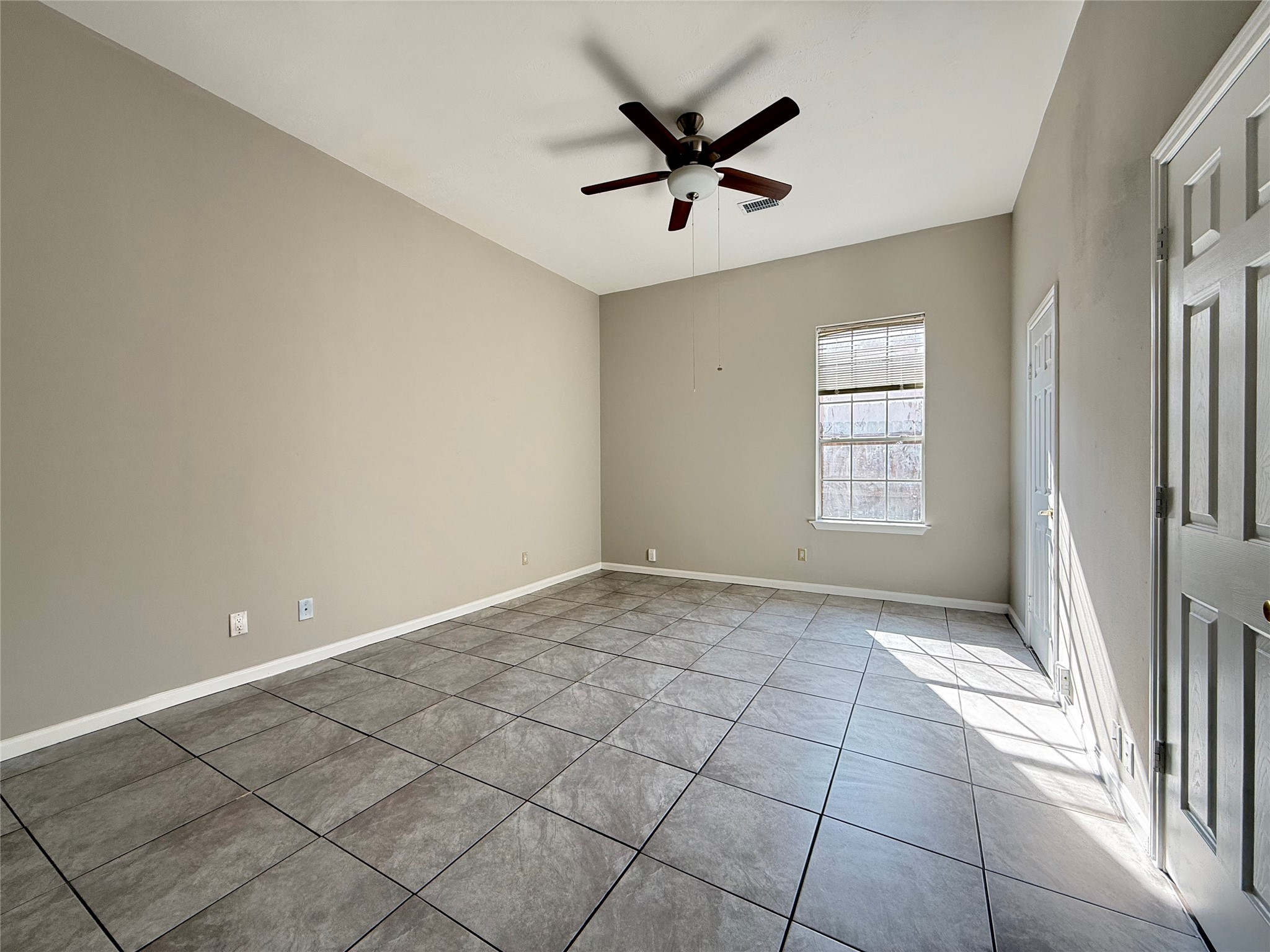 11346 Old Telegraph Road Houston, TX 77067 - Photo 15 of 20 a view of a livingroom with a ceiling fan and window