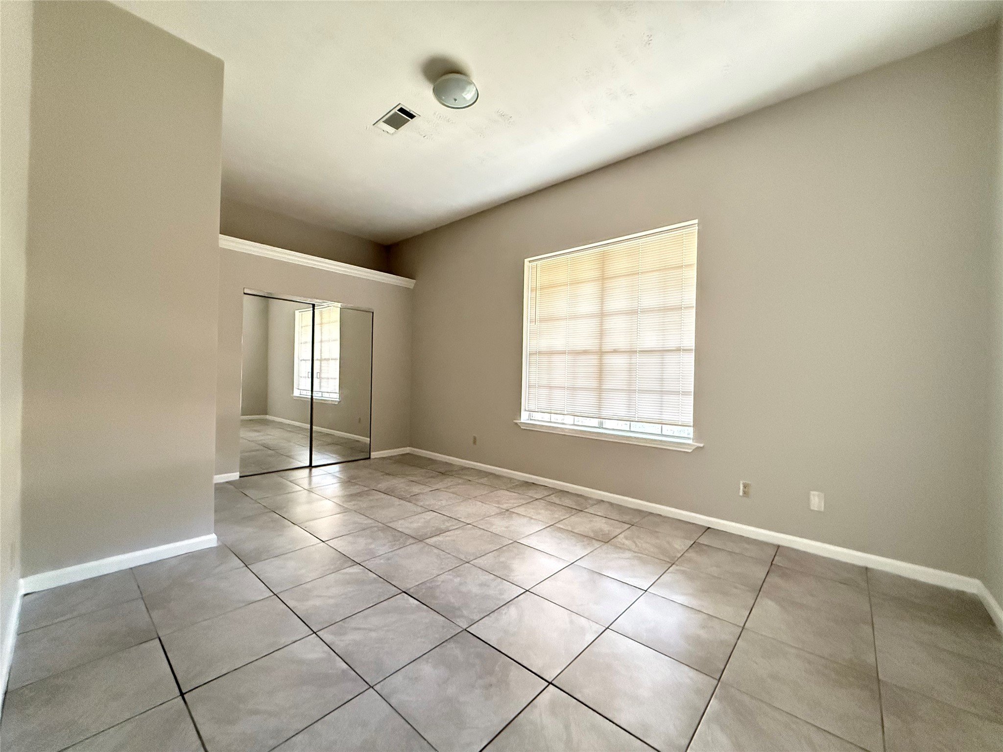 11346 Old Telegraph Road Houston, TX 77067 - Photo 16 of 20 a view of an empty room with window and a kitchen