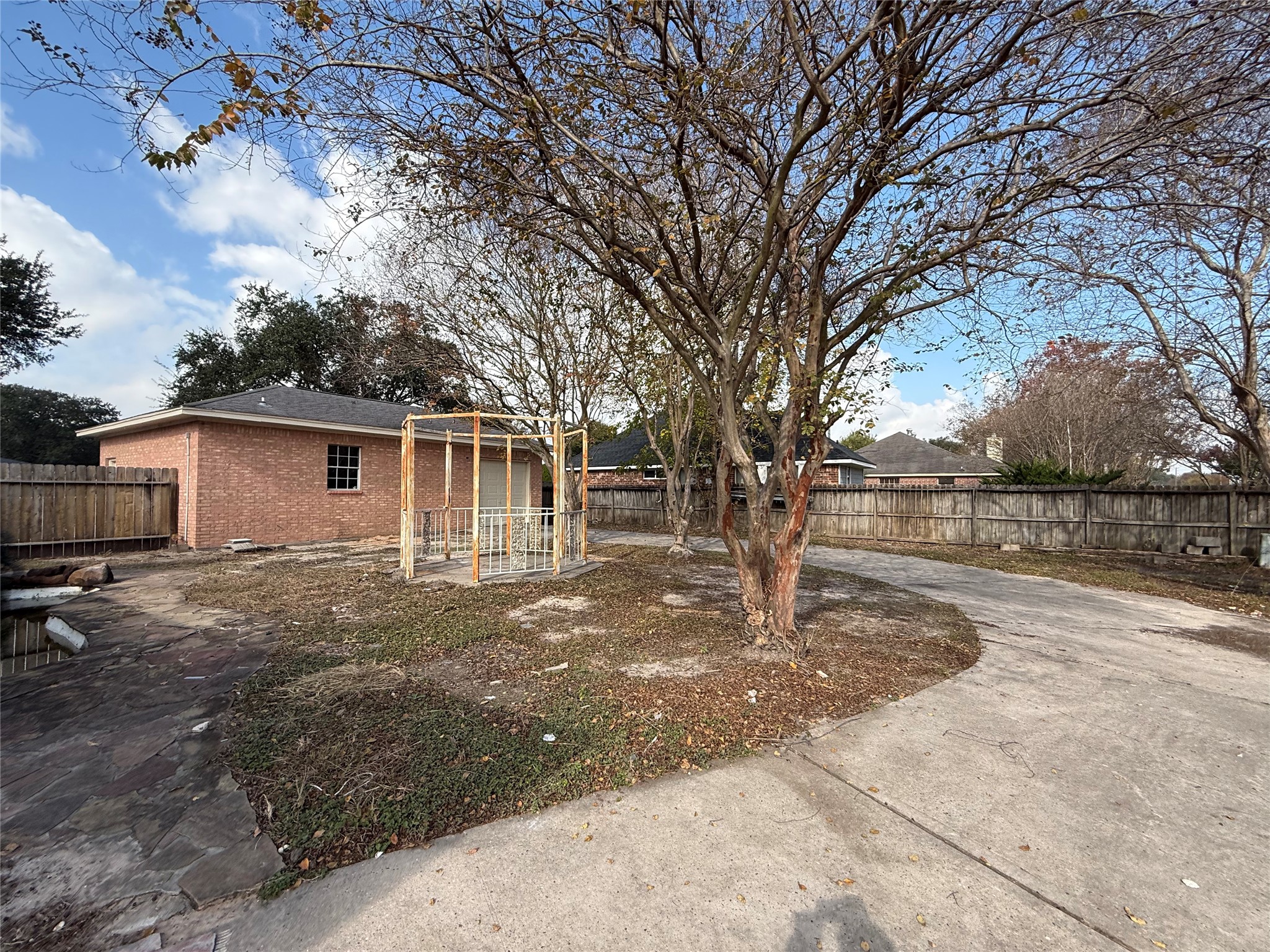 11346 Old Telegraph Road Houston, TX 77067 - Photo 19 of 20 a backyard of a house with table and chairs