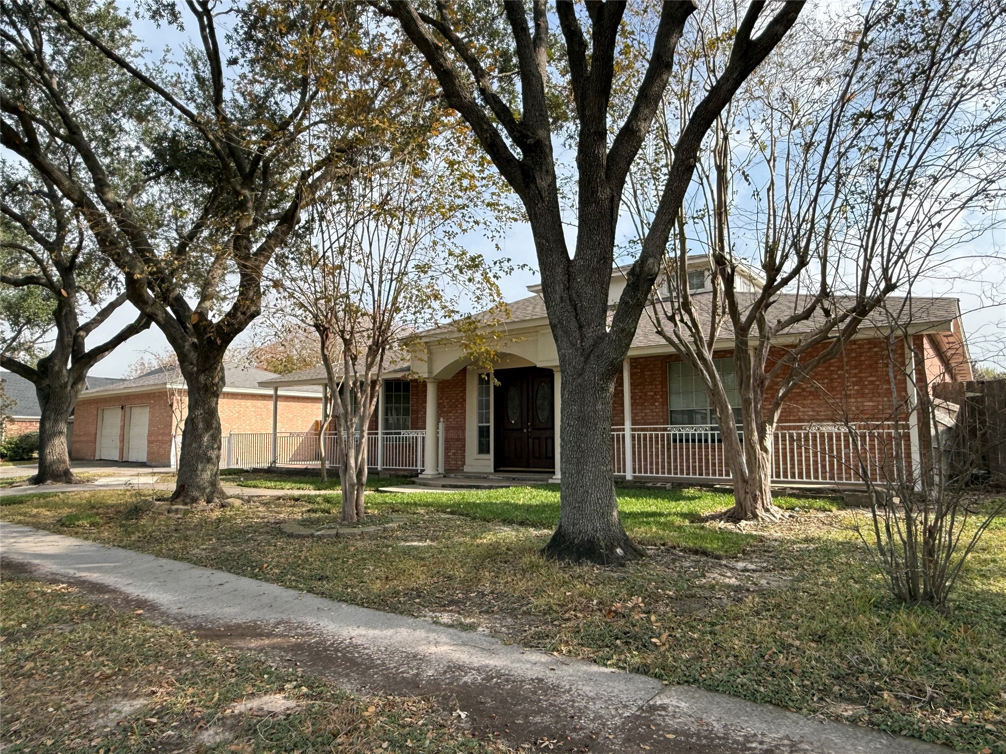 11346 Old Telegraph Road Houston, TX 77067 - Photo 2 of 20 a front view of a house with a tree s