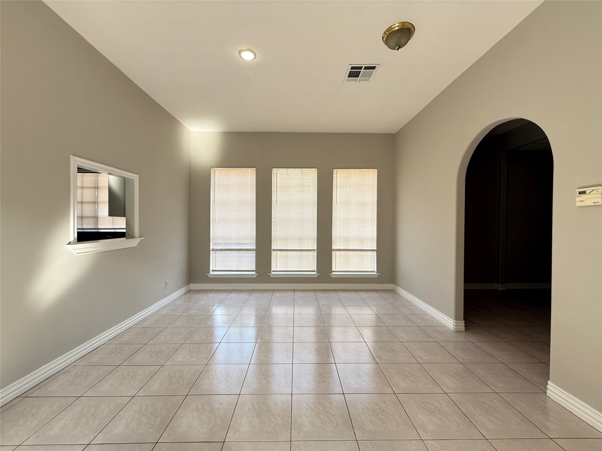 11346 Old Telegraph Road Houston, TX 77067 - Photo 6 of 20 a view of an empty room with a window