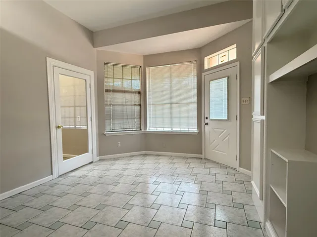 a bathroom with a toilet sink and shower