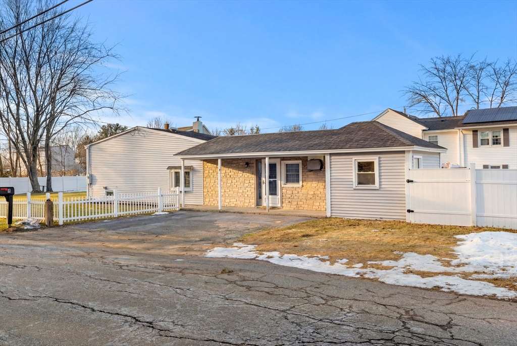 3 Adams Avenue Methuen, MA 01844 - Photo 1 of 37 a view of a yard in front of a house with a large tree
