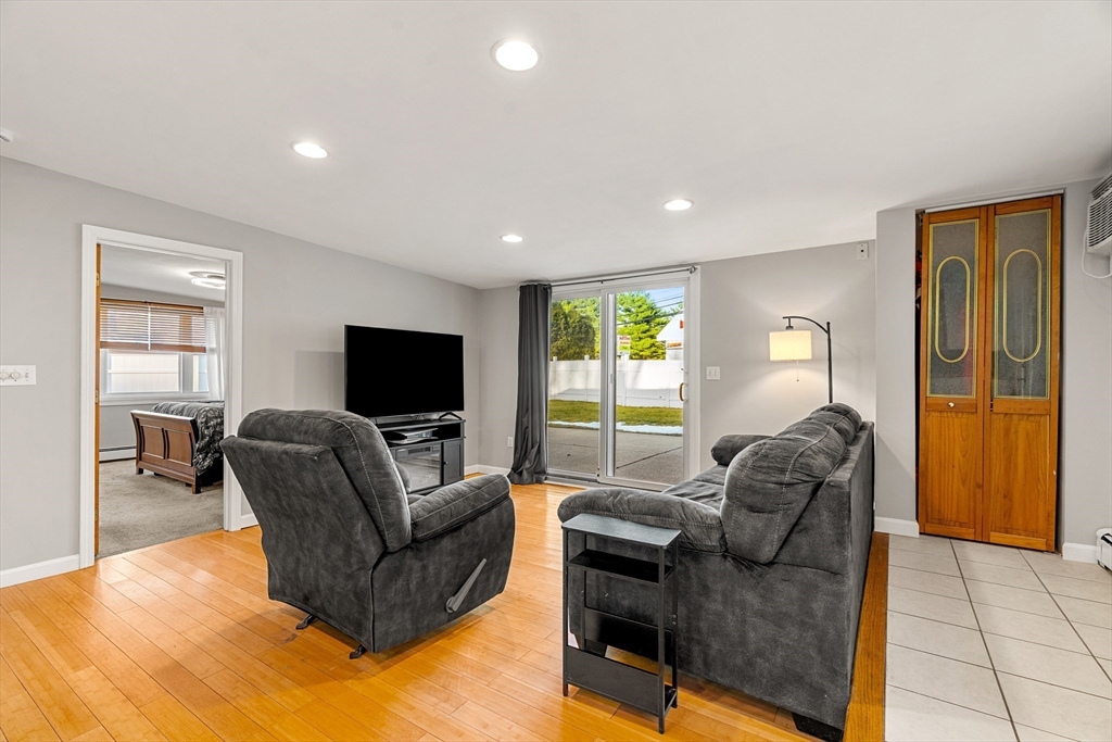 3 Adams Avenue Methuen, MA 01844 - Photo 14 of 37 a living room with furniture and a flat screen tv