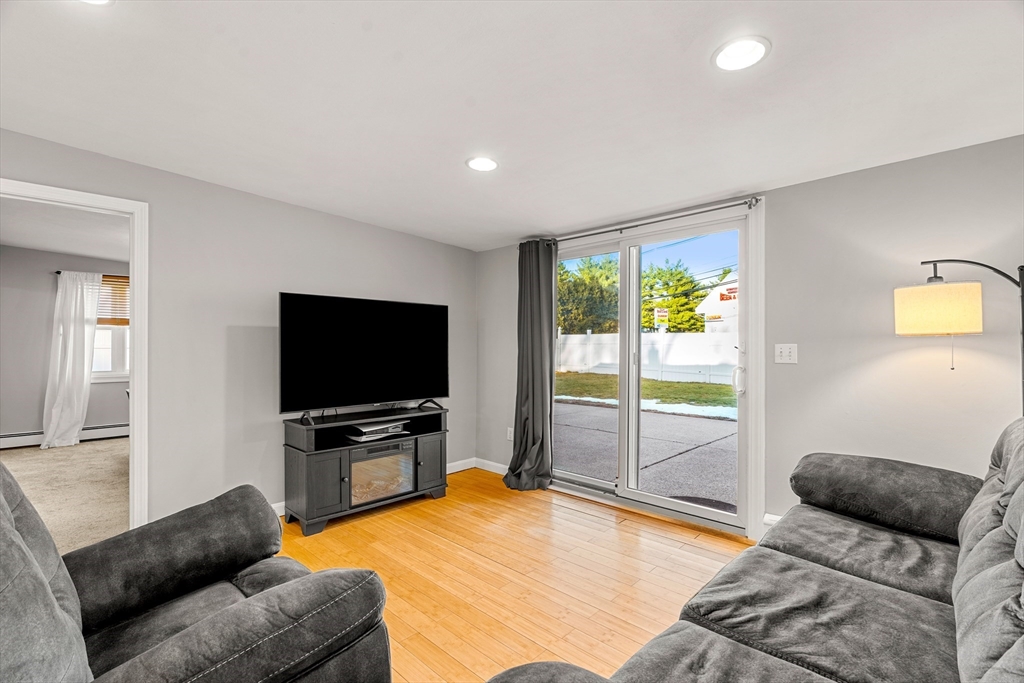 3 Adams Avenue Methuen, MA 01844 - Photo 15 of 37 a living room with furniture and a flat screen tv