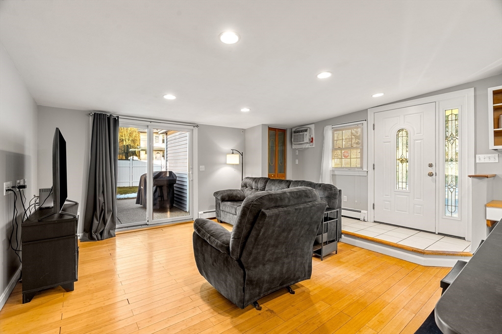 3 Adams Avenue Methuen, MA 01844 - Photo 16 of 37 a living room with furniture window and wooden floor