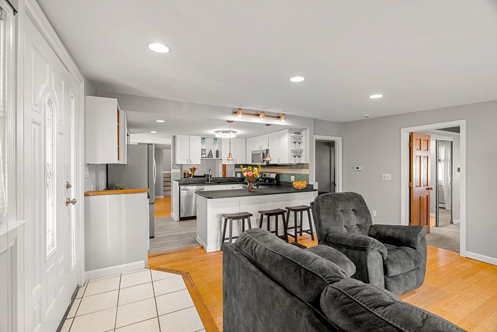 3 Adams Avenue Methuen, MA 01844 - Photo 18 of 37 a living room with furniture and kitchen view
