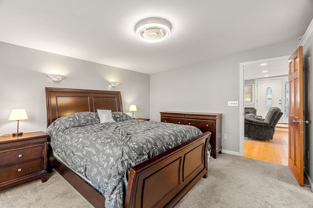 3 Adams Avenue Methuen, MA 01844 - Photo 20 of 37 a bedroom with a bed and a couch