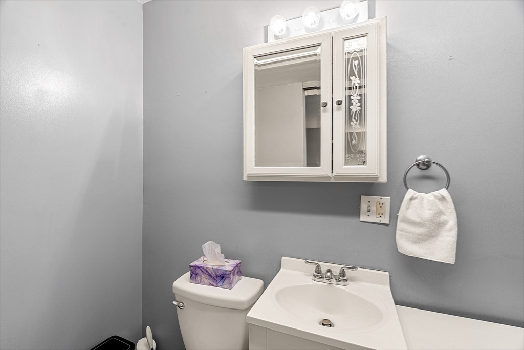 3 Adams Avenue Methuen, MA 01844 - Photo 23 of 37 a bathroom with a sink mirror and toilet