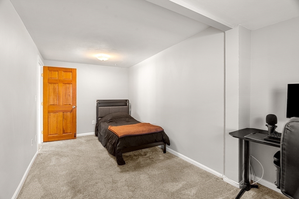 3 Adams Avenue Methuen, MA 01844 - Photo 25 of 37 a bedroom with a bed and a window