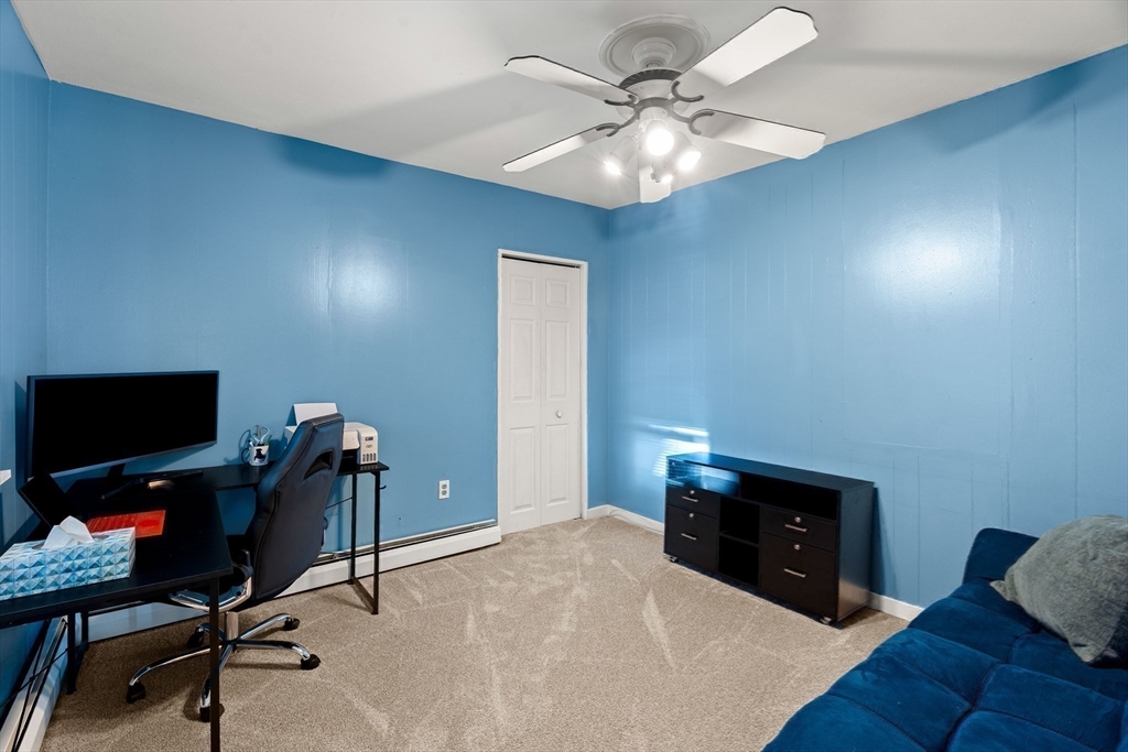 3 Adams Avenue Methuen, MA 01844 - Photo 26 of 37 a bedroom with a bed and a chandelier