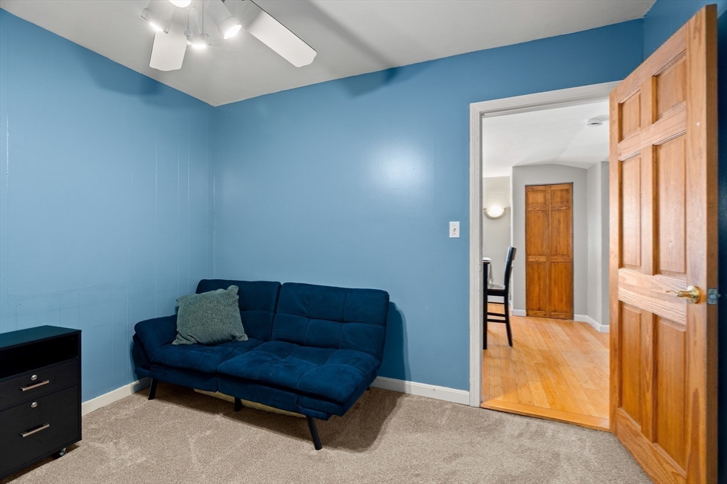3 Adams Avenue Methuen, MA 01844 - Photo 29 of 37 a living room with furniture and a gate