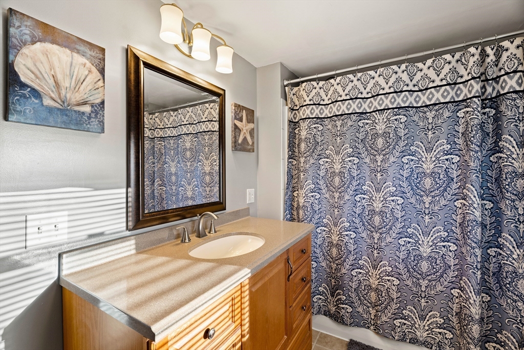 3 Adams Avenue Methuen, MA 01844 - Photo 31 of 37 a bathroom with a sink and a mirror