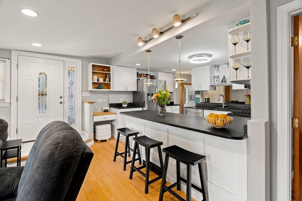 3 Adams Avenue Methuen, MA 01844 - Photo 6 of 37 a dining room with stainless steel appliances furniture a rug and a kitchen view