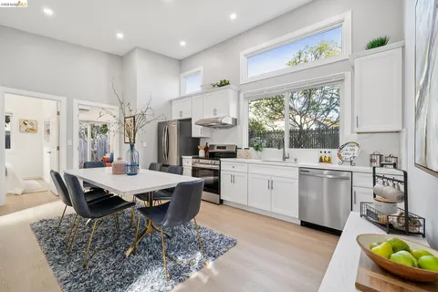 a kitchen with sink cabinets and wooden floor