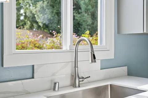 a view of a bathroom with a sink and mirror