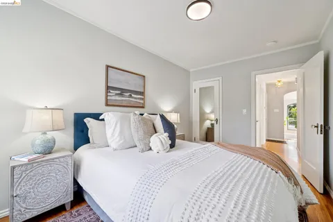 a bedroom with a bed and a lamp