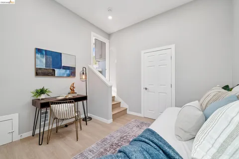 a bedroom with a bed and a chair