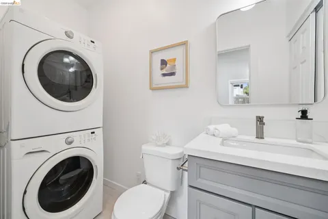a bathroom with a sink mirror and toilet