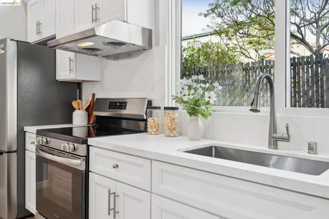 a kitchen with a sink and cabinets