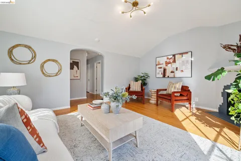 a living room with furniture and a rug
