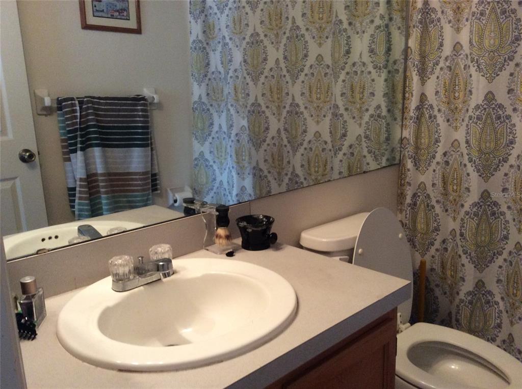 4415 Southwest 34th Street, Unit 607 Gainesville, FL 32608 - Photo 11 of 16 a bathroom with a sink and a toilet