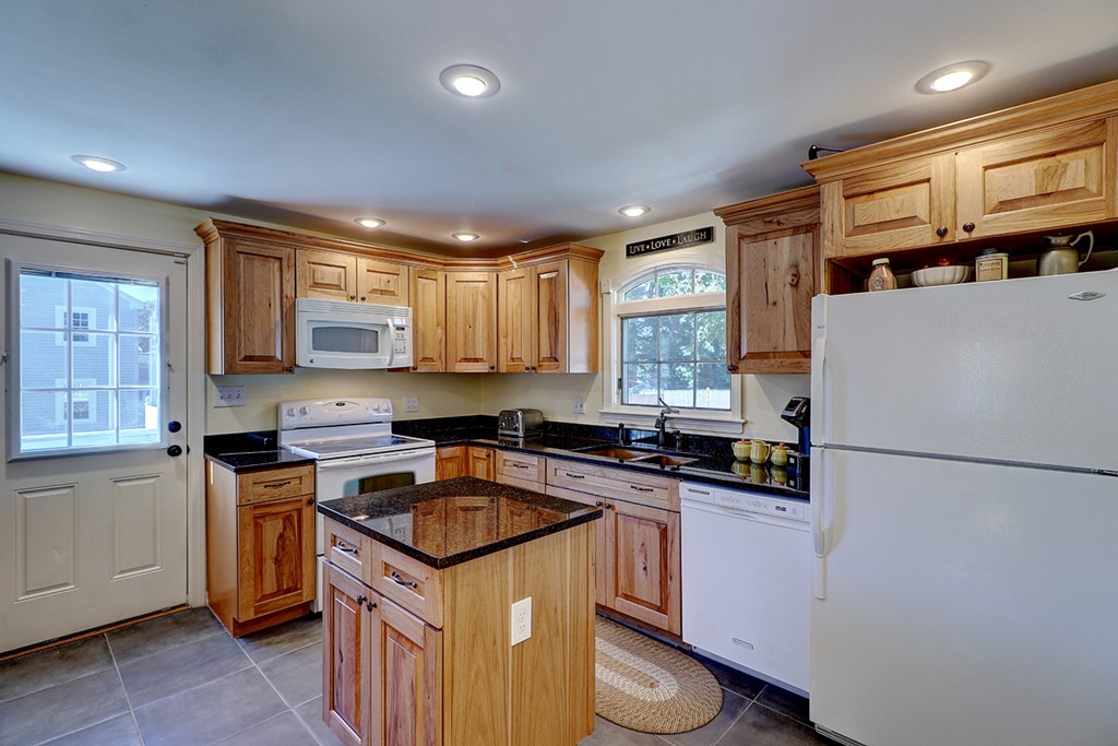 70 Linden Road Seekonk, MA 02771 - Photo 14 of 25 a kitchen with a sink a stove a refrigerator a center island and a window