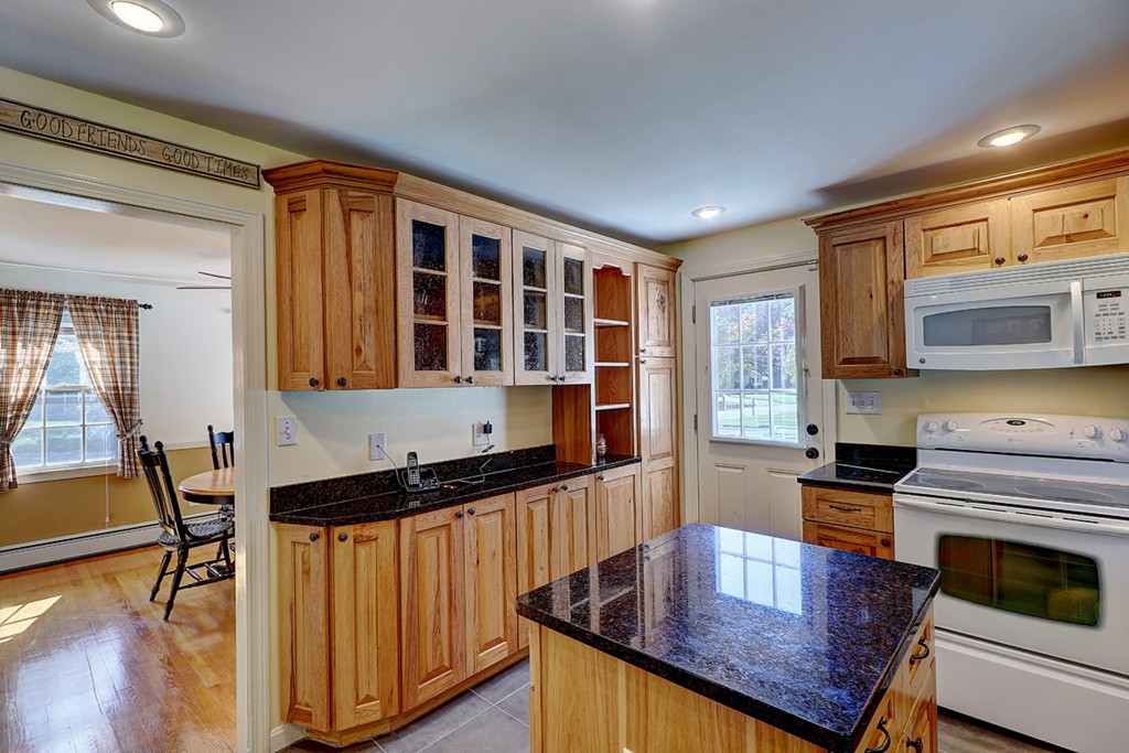 70 Linden Road Seekonk, MA 02771 - Photo 15 of 25 a kitchen with granite countertop a stove and cabinets