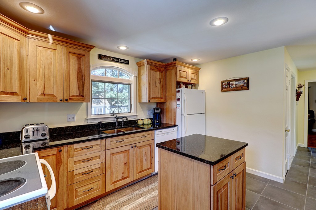 70 Linden Road Seekonk, MA 02771 - Photo 16 of 25 a kitchen with granite countertop a sink stove and refrigerator