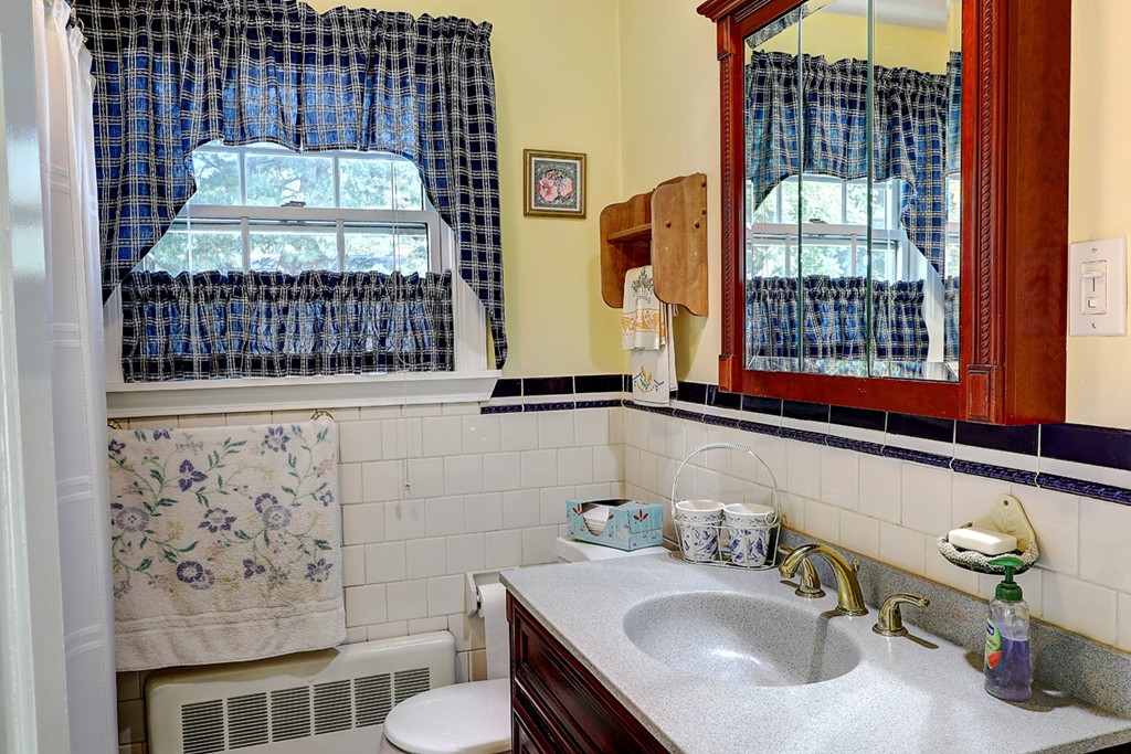 70 Linden Road Seekonk, MA 02771 - Photo 19 of 25 a bathroom with a sink a toilet and mirror