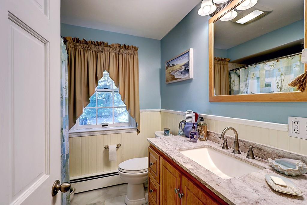 70 Linden Road Seekonk, MA 02771 - Photo 24 of 25 a bathroom with a granite countertop toilet sink and mirror